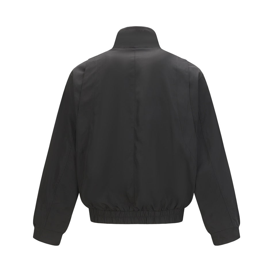 Back view of a black jacket with a stand collar, long sleeves, and an elasticated hem.
