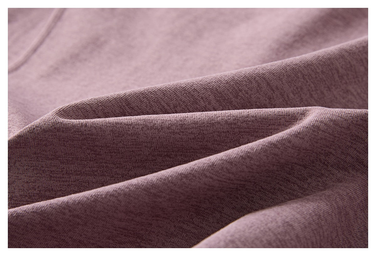 Close-up showing the knit texture and drape of mauve heather fabric.