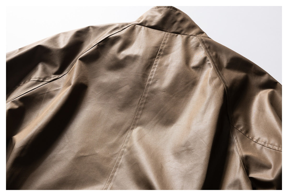 Close-up of the taupe-brown jacket's back yoke, collar, and stitched panels.