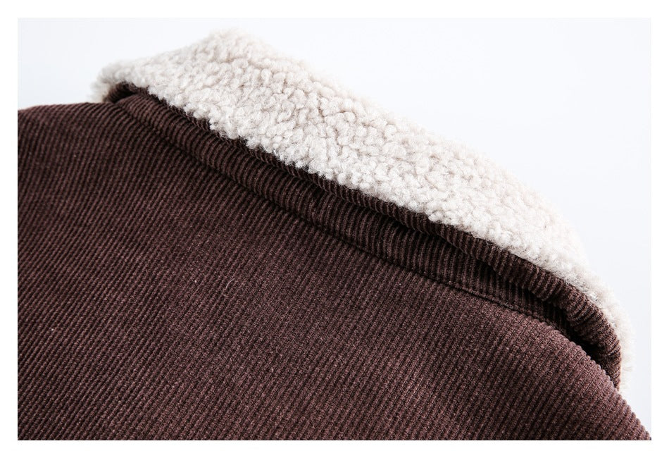 Close-up of a dark brown ribbed jacket with a cream curly fleece lining along the edge.
