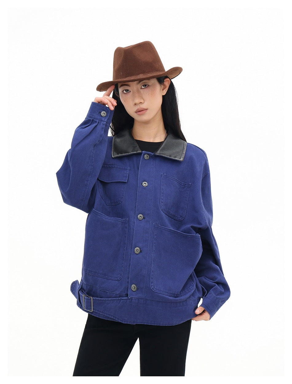 Model wearing a cobalt-blue utility jacket with a black collar, four pockets, star buttons and an adjustable hem belt.