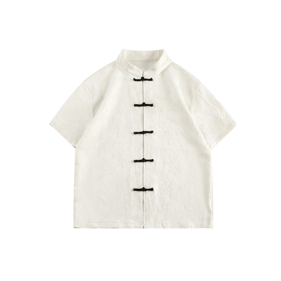 Off-white short-sleeve stand-collar shirt with textured jacquard and five black knot buttons, flat lay front view