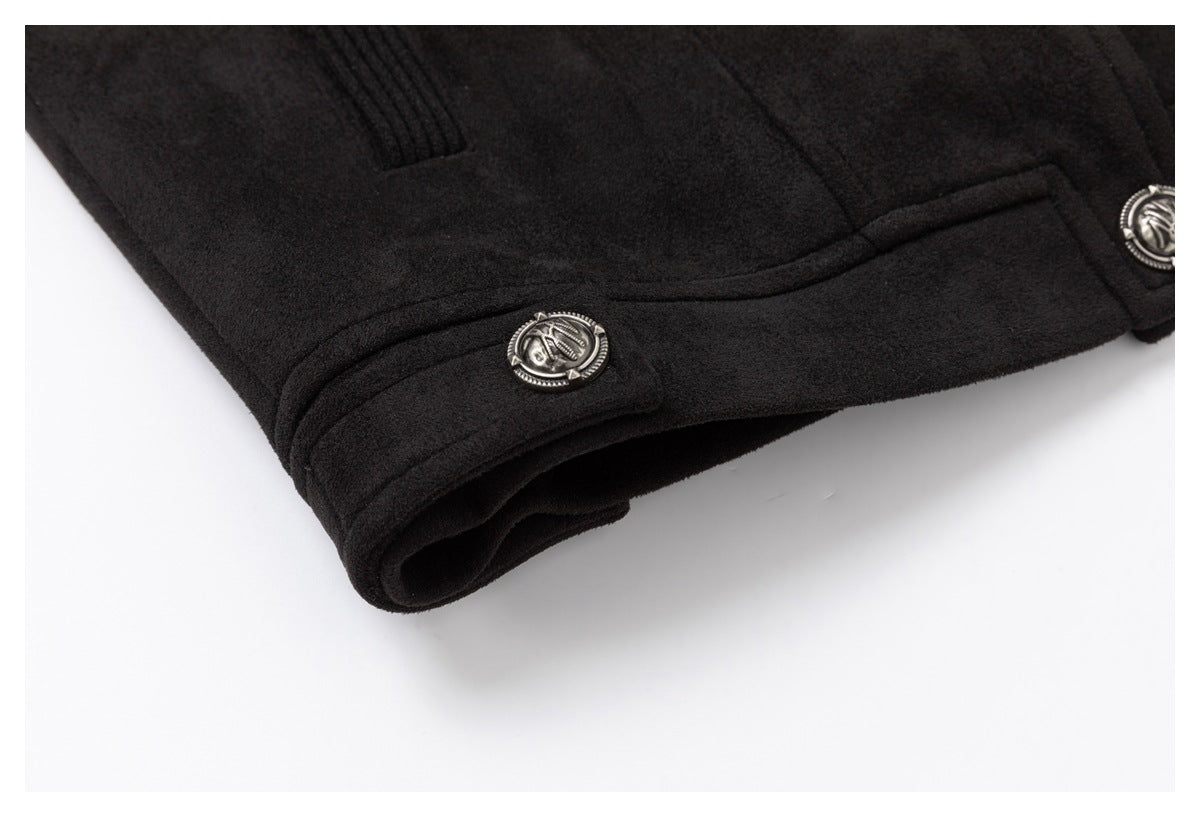 Close-up of a black garment cuff with stitched trim and decorative silver-tone buttons.