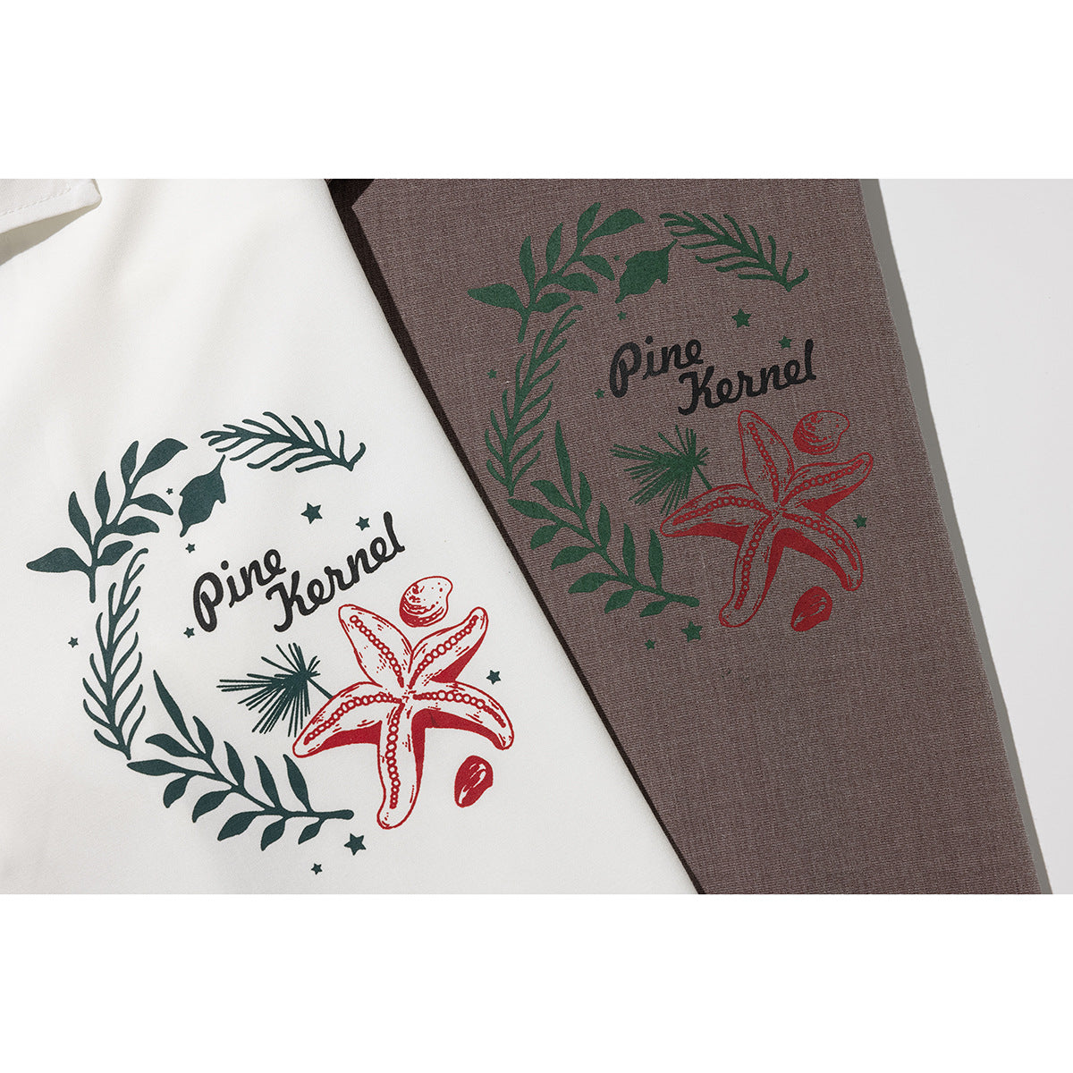 Close-up of white and brown shirts with matching leafy wreath, starfish, and “Pine Kernel” prints.