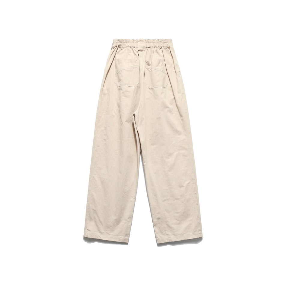 Back view of cream wide-leg trousers with an elasticated waistband and two rear pockets.