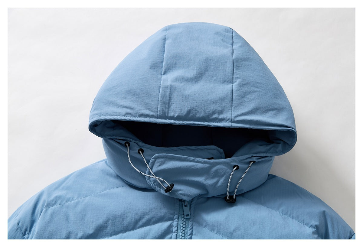 Close-up of a light blue jacket hood with drawcords and a front zipper.