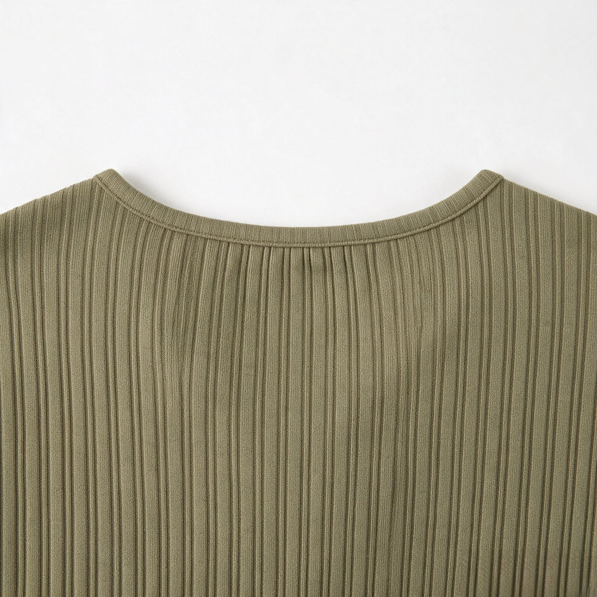 Close-up of the olive ribbed shirt's back neckline and shoulder seams.
