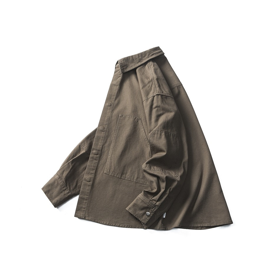 Olive-brown long-sleeve shirt arranged at an angle, showing its button front, collar, patch pocket, and button cuff.