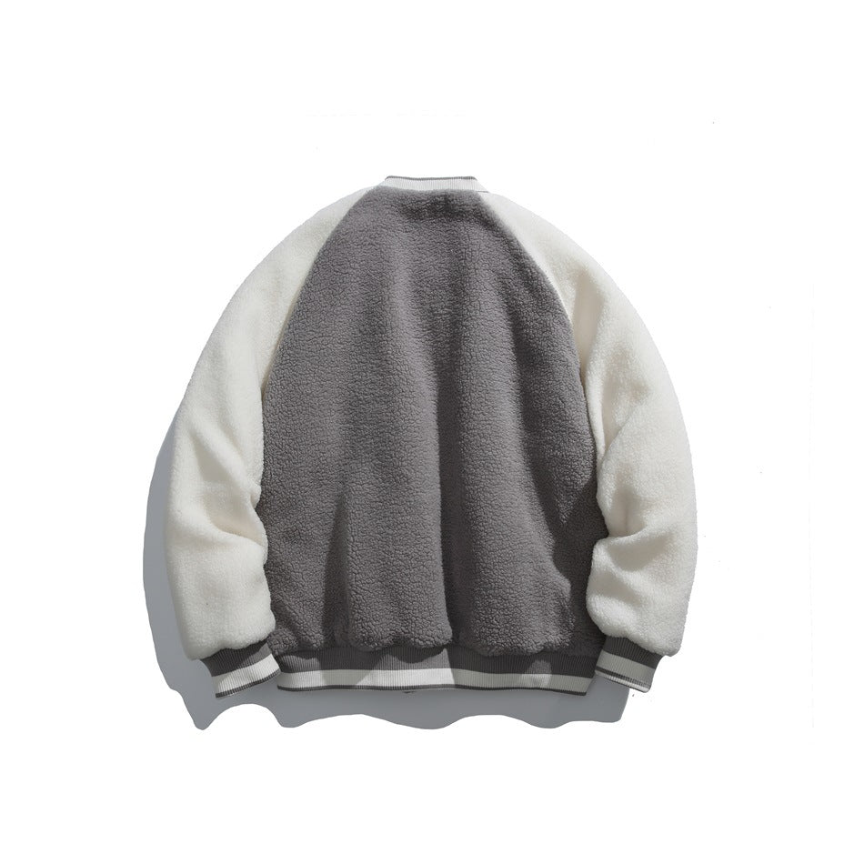 Back view of a jacket with a gray body, cream sleeves and striped ribbed cuffs and hem.