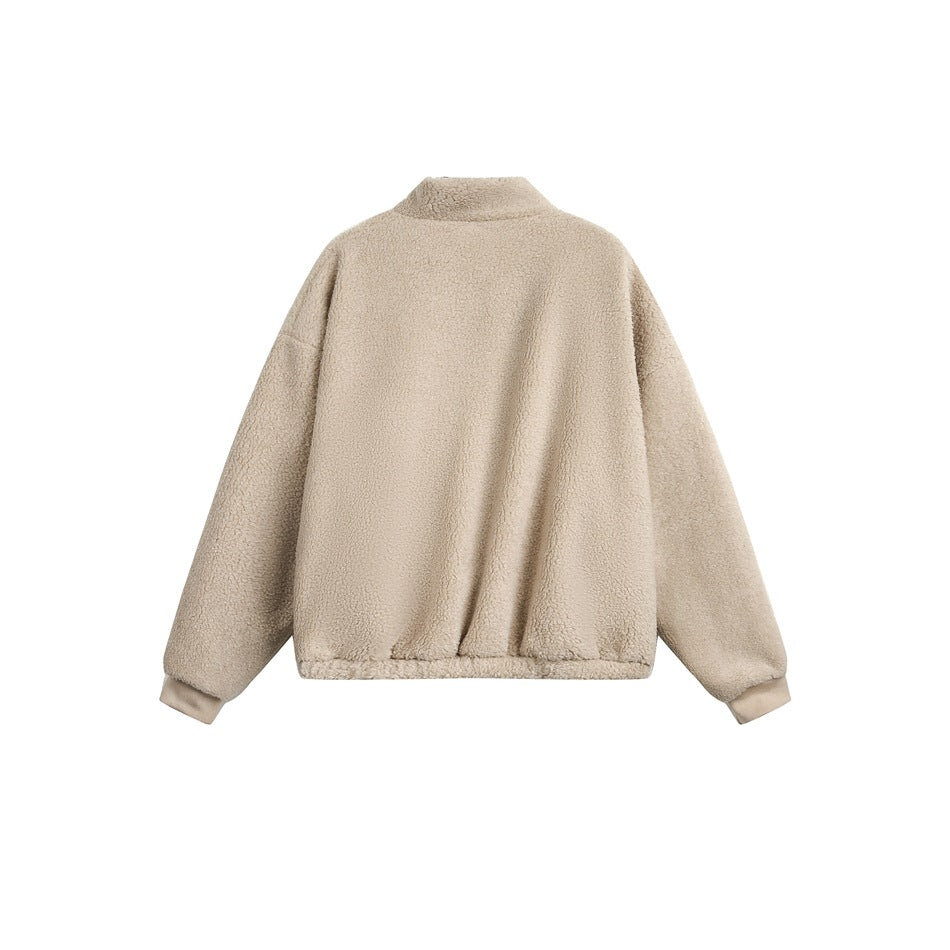 Back view of a beige fleece jacket with a stand collar, long sleeves, and ribbed cuffs and hem, on white.