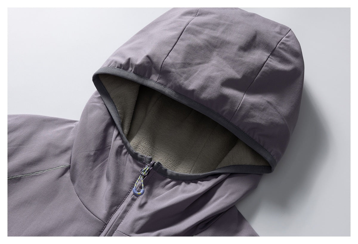 Close-up of a muted purple jacket hood with dark trim and a soft gray interior lining.