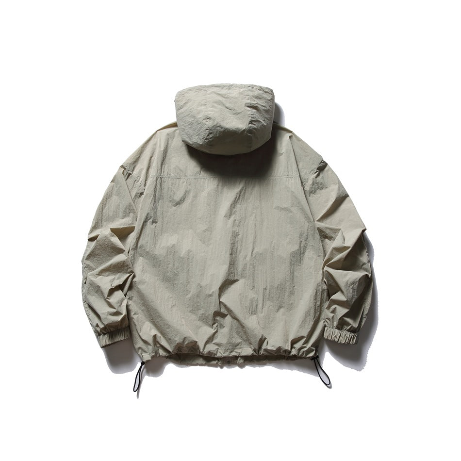 Back view of a light beige hooded jacket with elastic cuffs and adjustable drawcord hem.