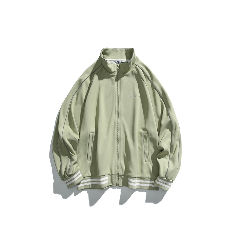 Fruit green zip-front stand-collar jacket with raglan sleeves, piping and white-striped ribbed cuffs and hem, flat lay