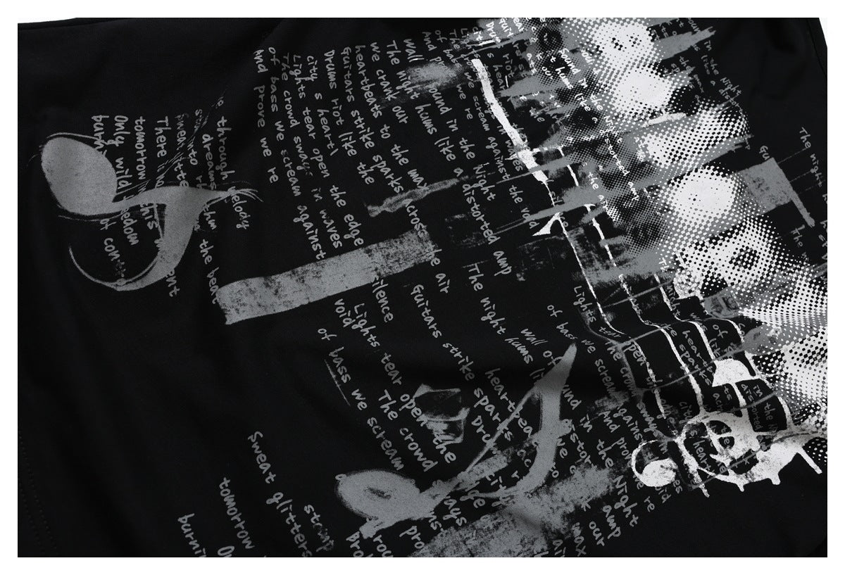 Close-up of the black shirt's gray and white abstract graphic print with handwritten-style English text.