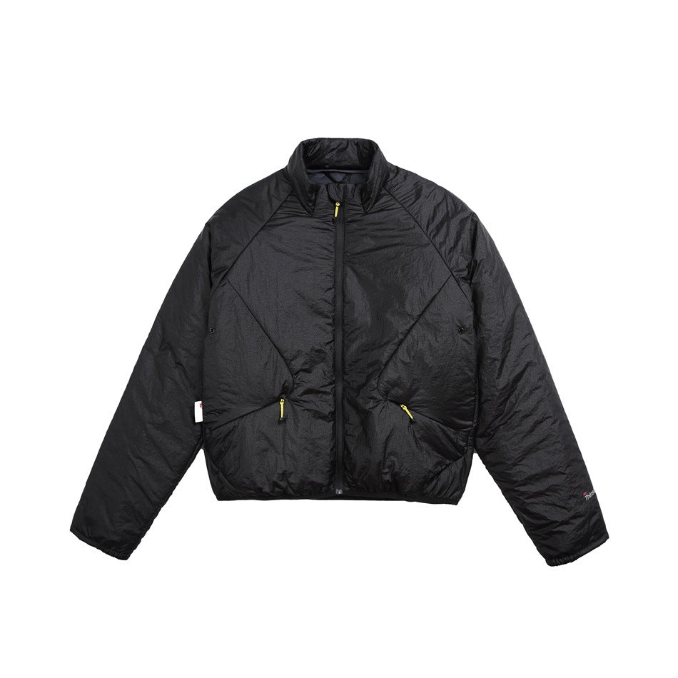 Black padded stand-collar jacket, front view, with center zipper, diagonal seams and zip pockets with yellow pulls