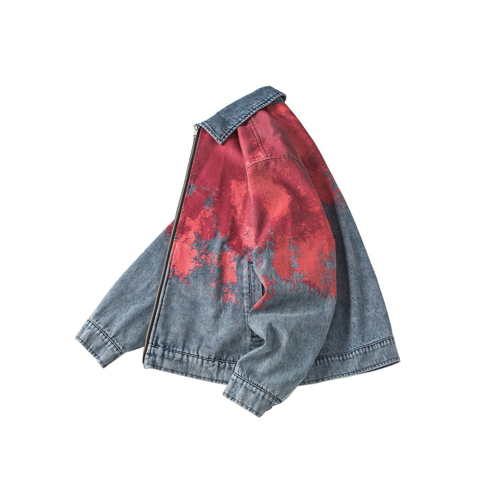 Three-quarter side view of a red and blue distressed denim zip jacket with a contrasting blue collar.