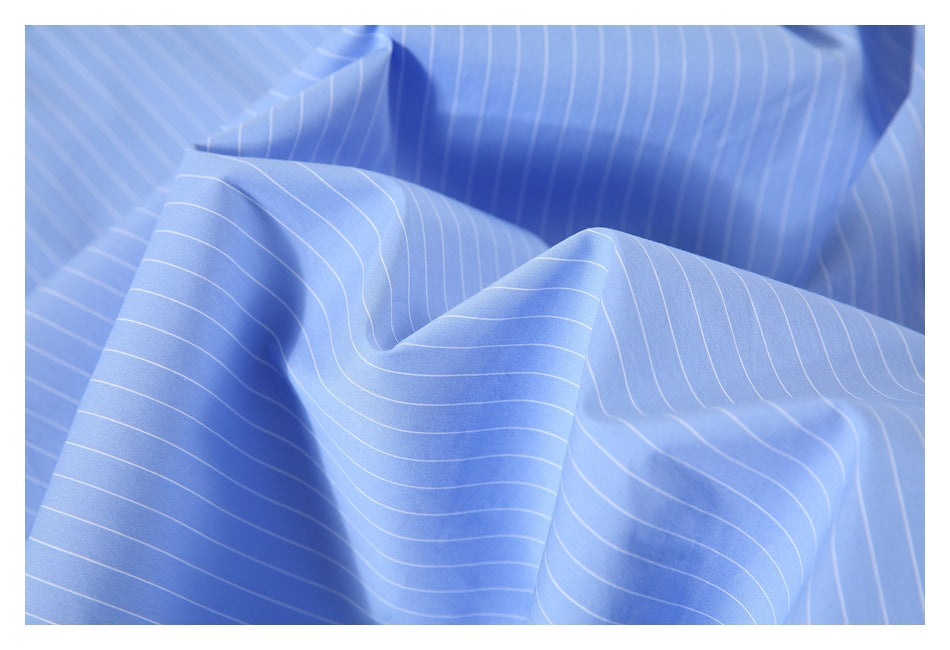 Draped light blue fabric with thin white pinstripes, shown in close-up.