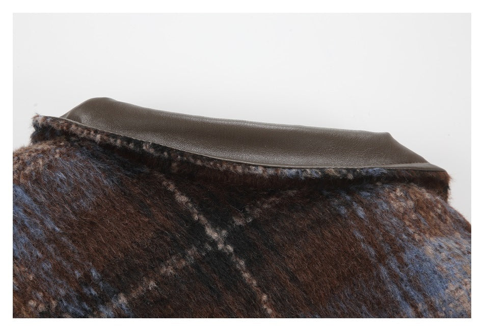 Close-up of the plaid coat collar with a smooth dark brown contrasting panel.
