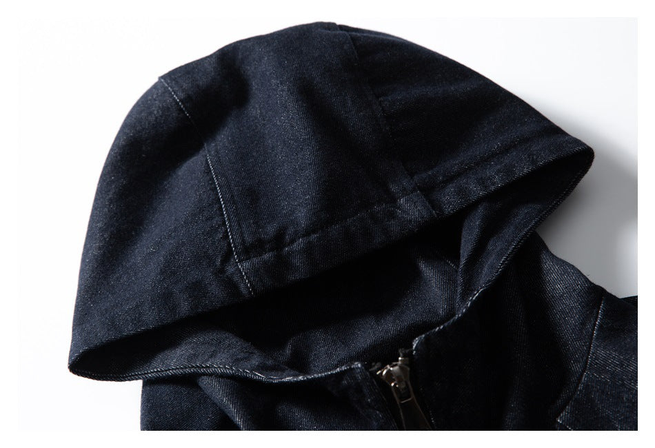 Close-up of the dark indigo jacket's hood, seams, and zipper.