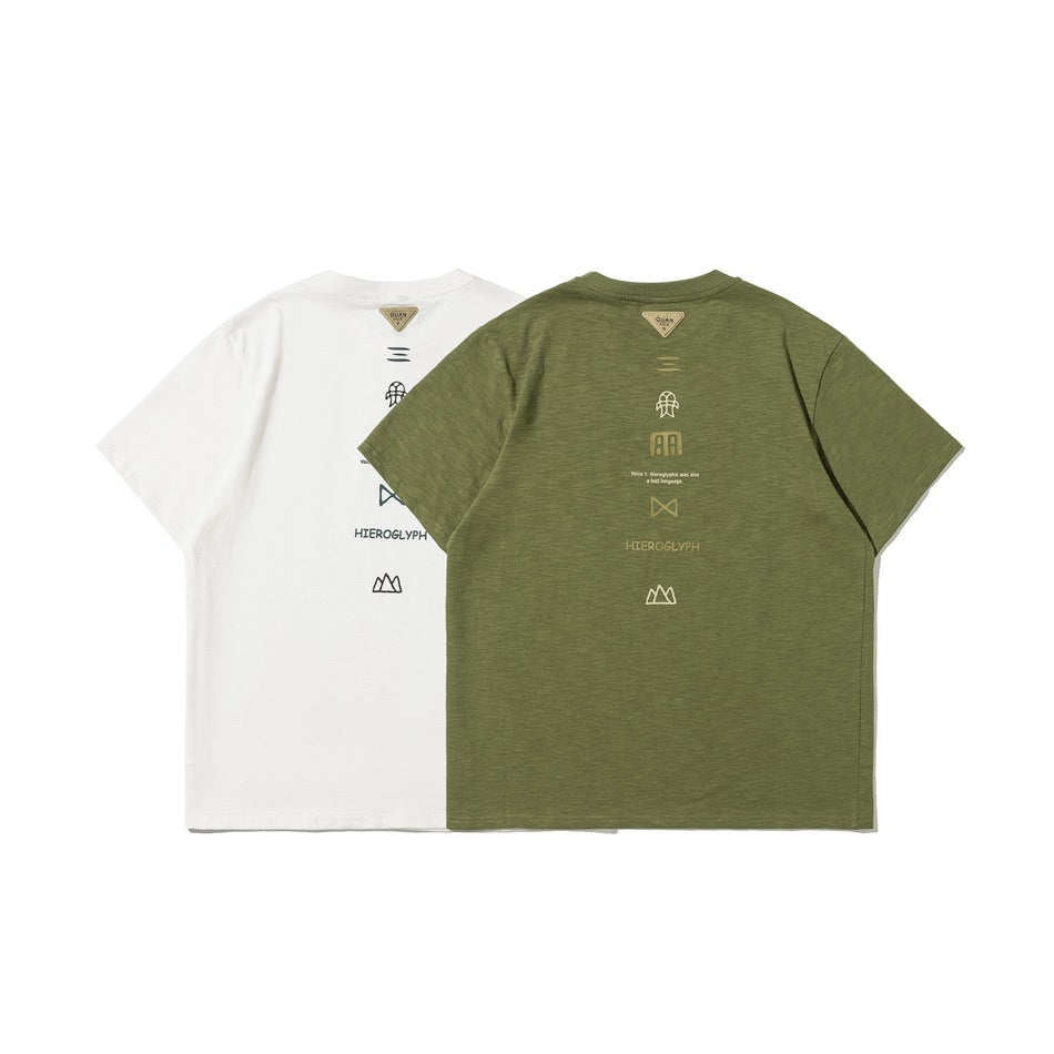 White and olive green T-shirts shown from the back, each with a vertical row of small graphics.