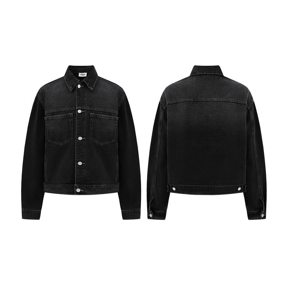 Black denim jacket shown from the front and back, with two chest pockets, silver buttons, and long sleeves.