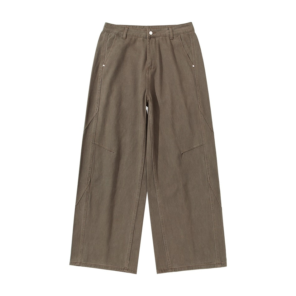 Brown wide-leg pants flat lay, front view, with zip fly, slant pockets and curved seam details