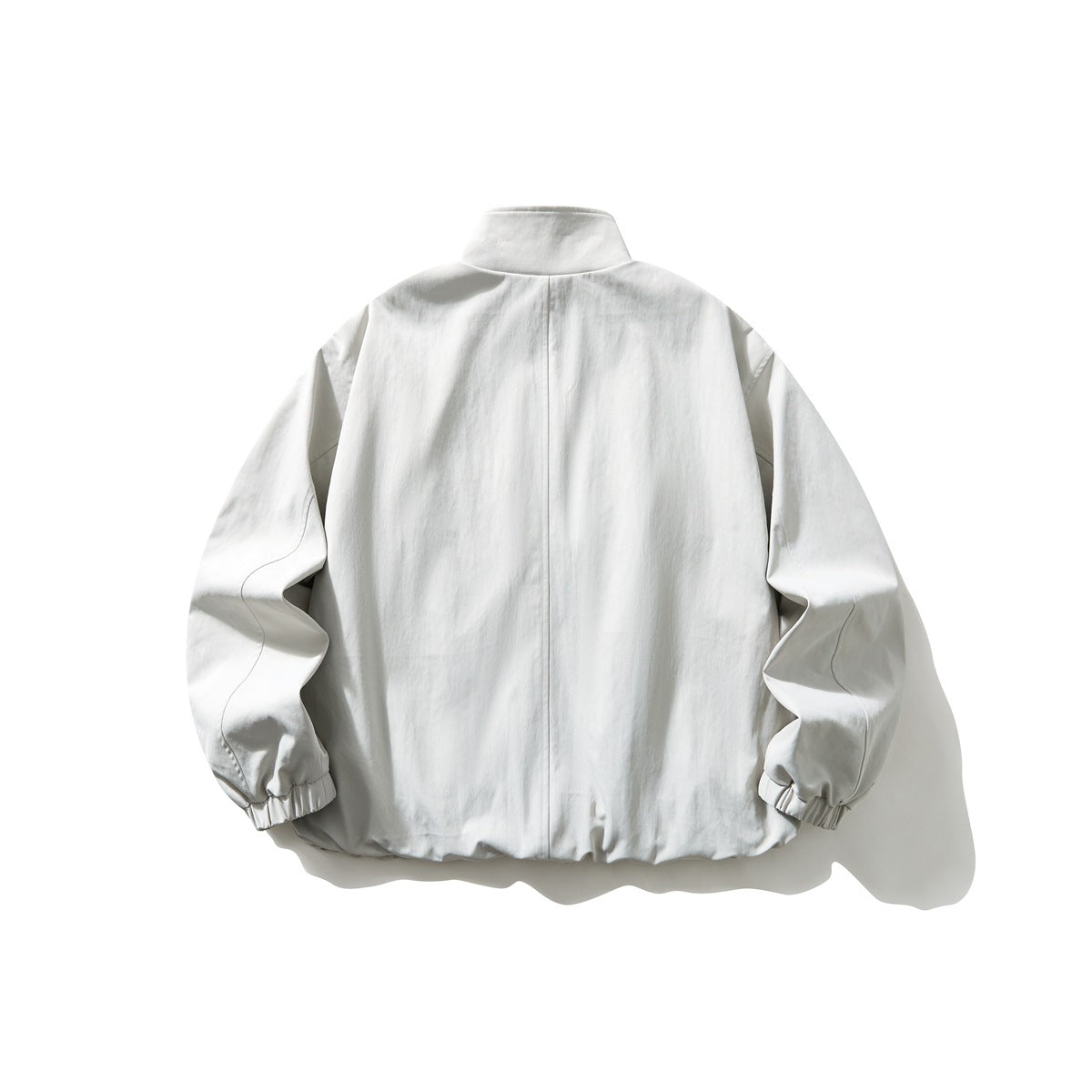 Back view of an off-white stand-collar jacket with long sleeves and gathered cuffs.