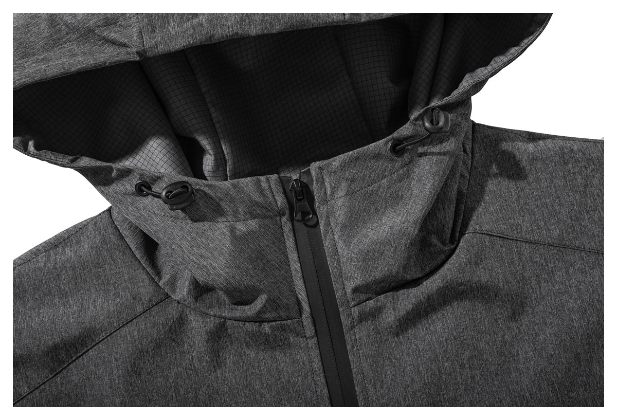Close-up of the charcoal jacket's hood, black grid lining, drawcords and front zipper.