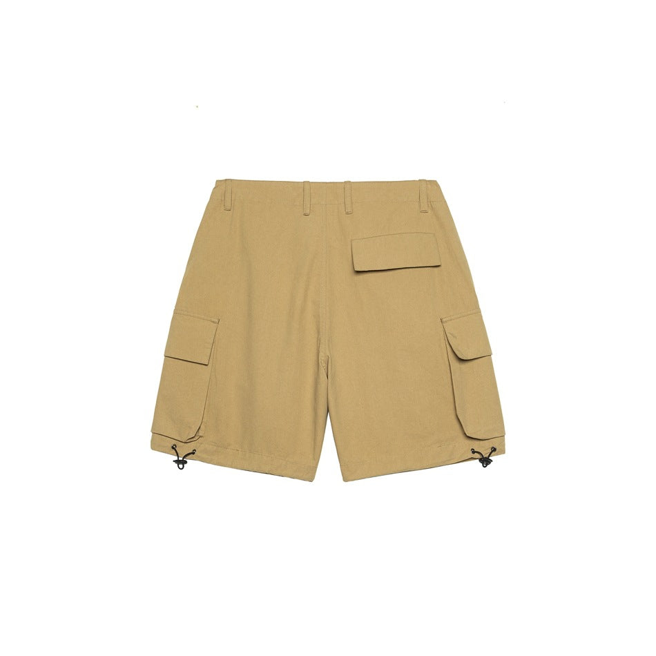 Front flat lay of tan cargo shorts with multiple flap pockets, belt loops and adjustable hem cords.