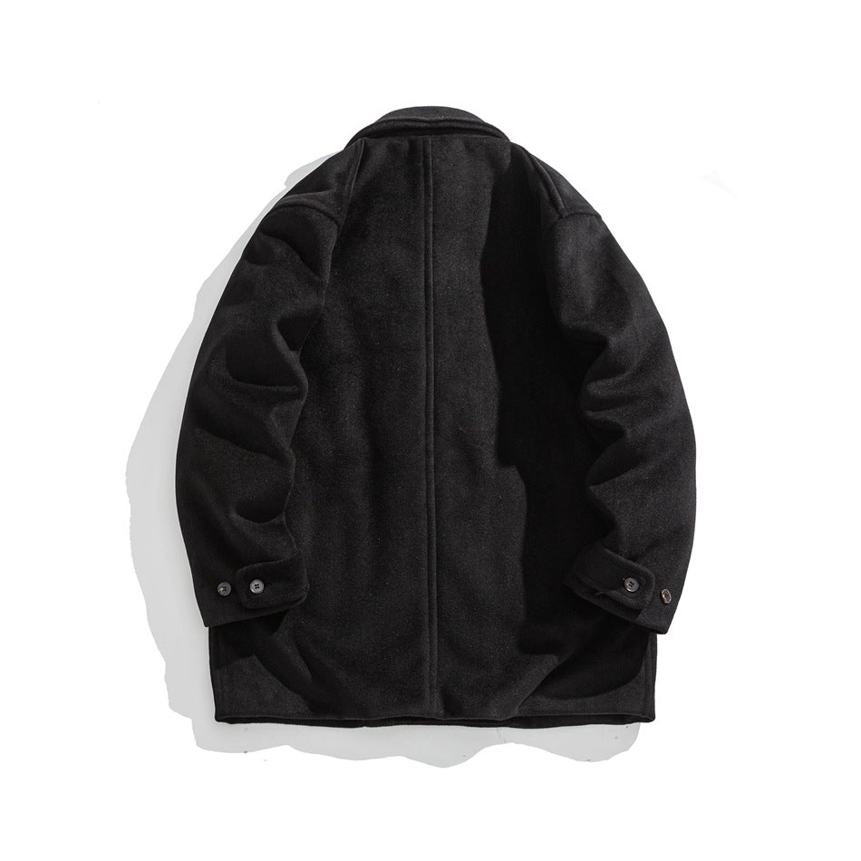 Back view of black mid-length coat showing center back seam, collar and button-tab cuffs, flat lay