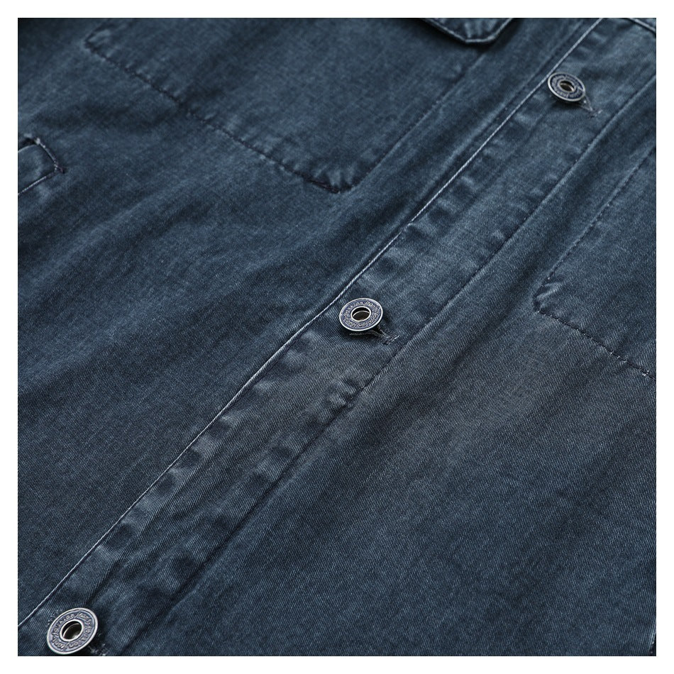 Close-up of the dark blue denim jacket front placket and metal buttons.