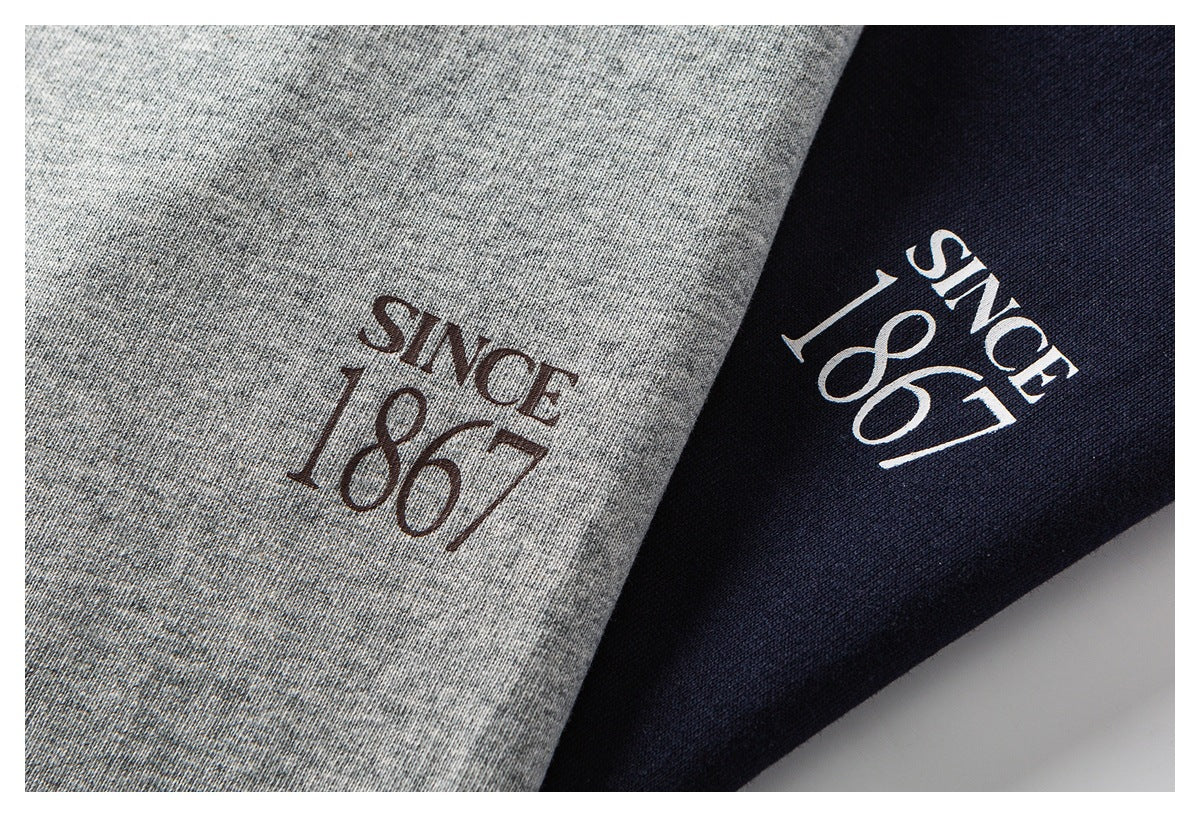 Close-up of gray and navy fabric panels, each printed with “Since 1867.”