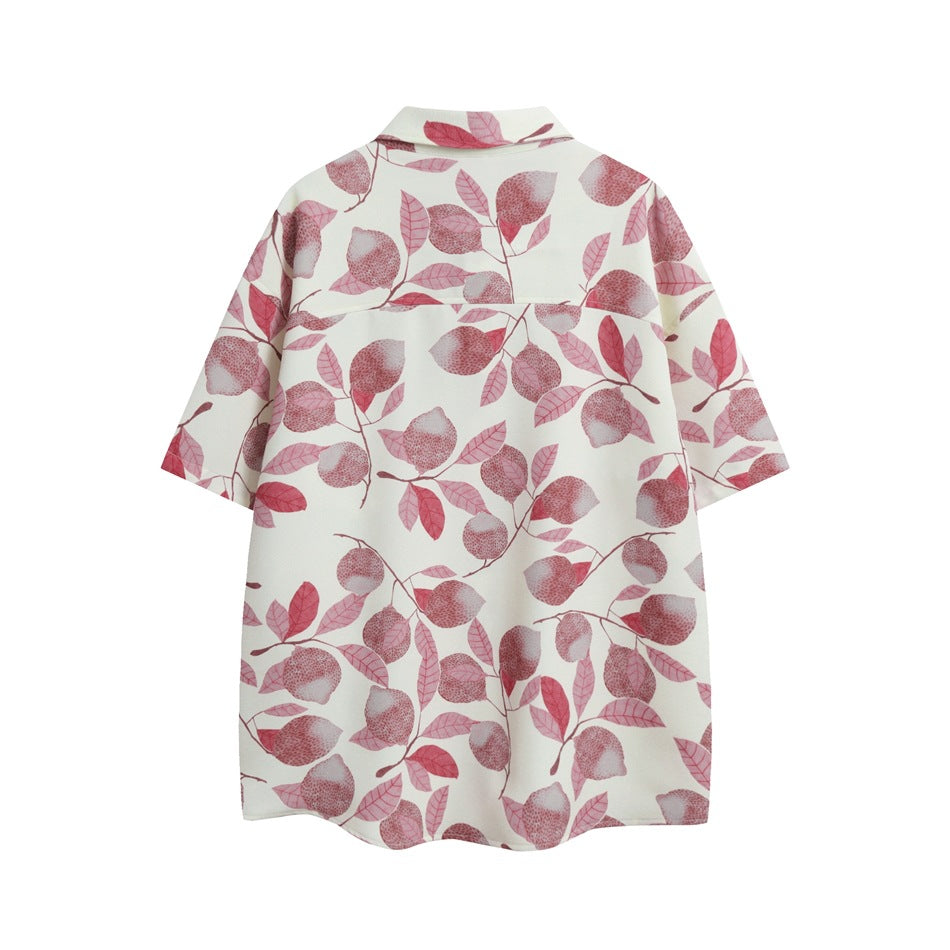 Back view of an ivory short-sleeve button-up shirt with a pink lemon-and-leaf print.