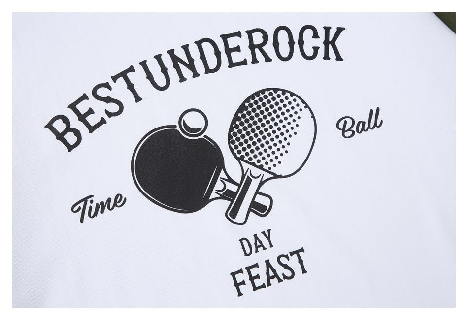 Close-up of a black table tennis paddle graphic and English lettering printed on white fabric.