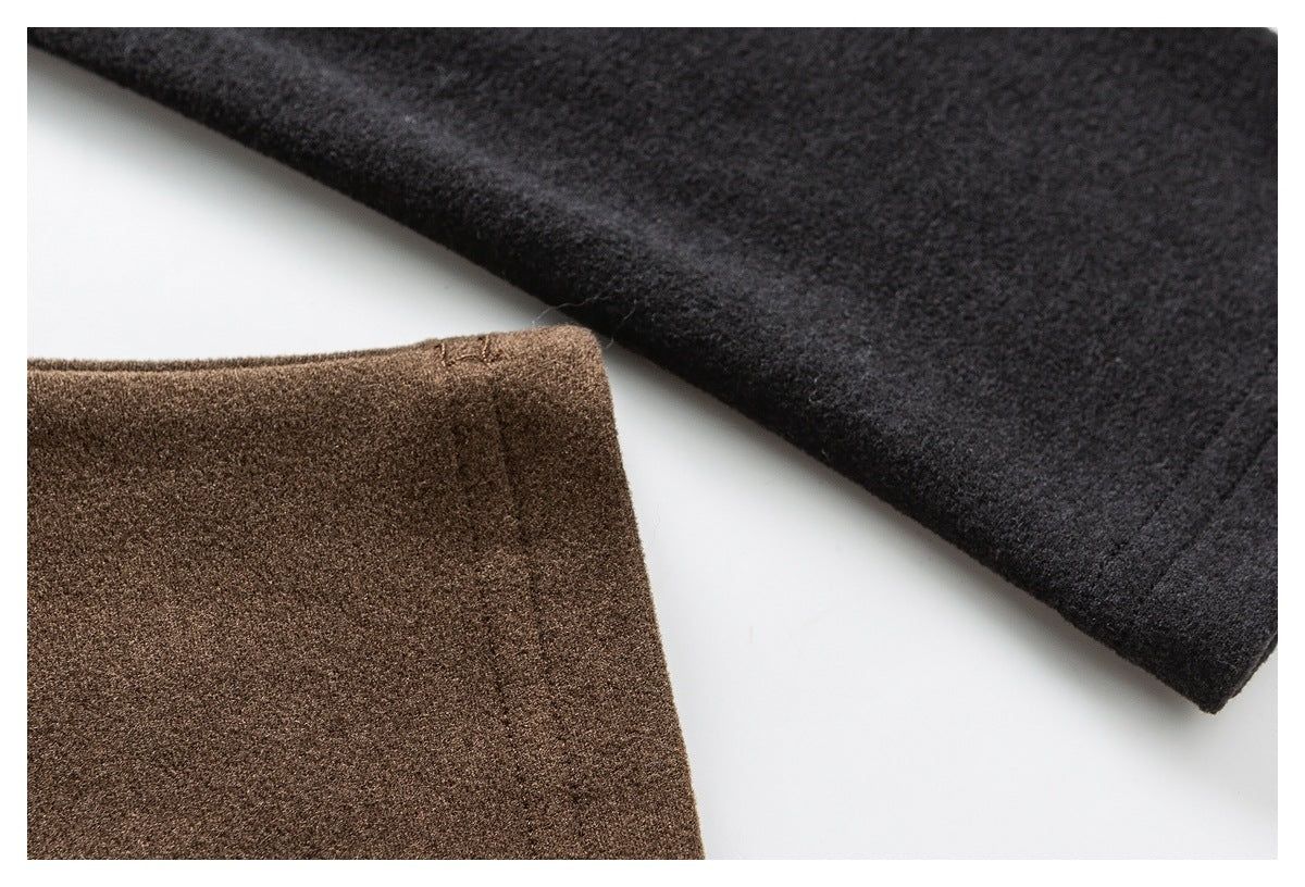 Close-up of brown and charcoal fabric panels with finished edges.
