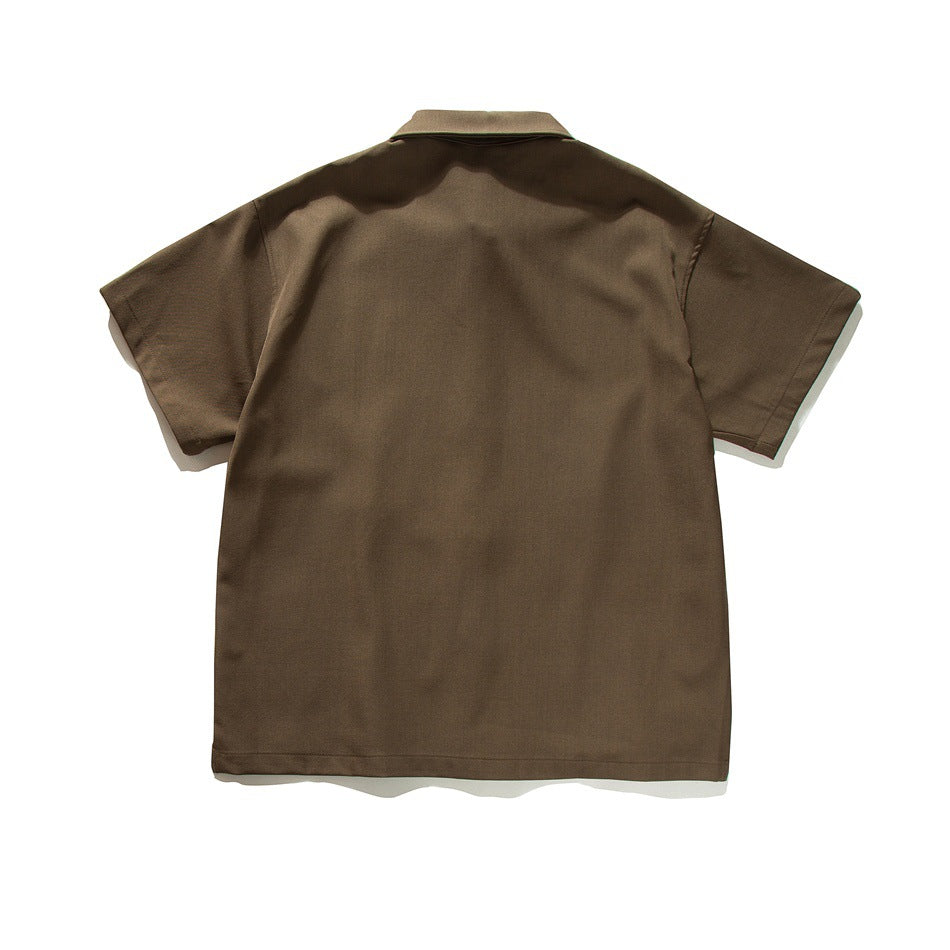 Back view of a dark brown short-sleeve collared button-up shirt laid flat.