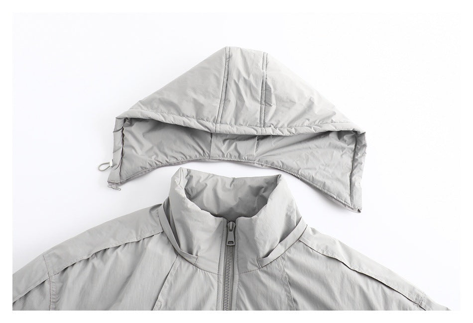 Light gray jacket upper front with its hood displayed separately above the high collar and center zipper.