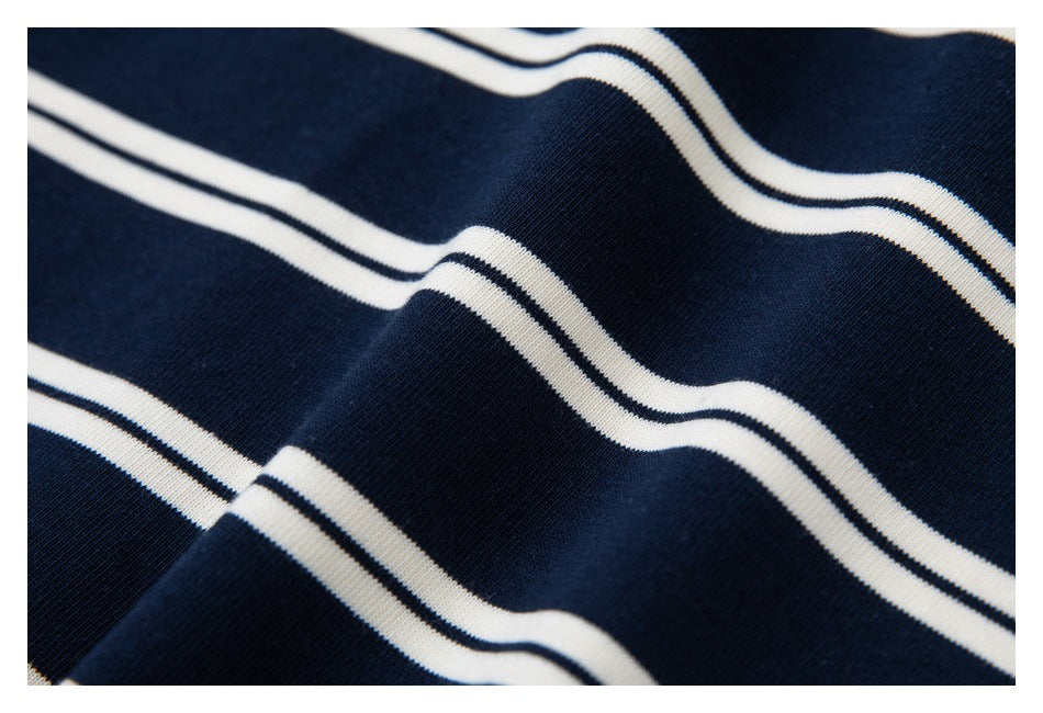 Close-up showing the navy fabric and narrow white horizontal stripes draped in folds.