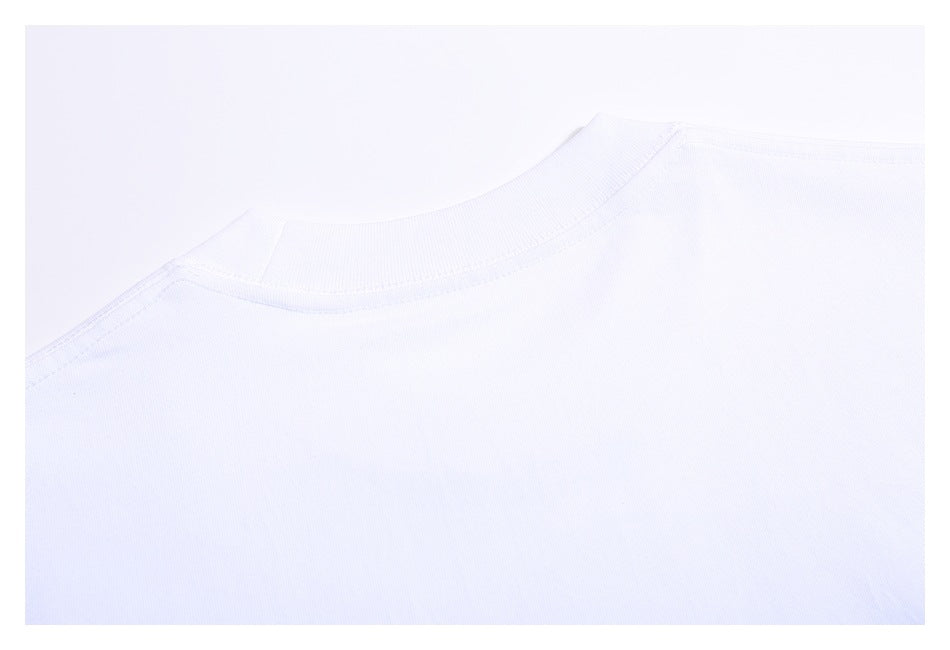 Close-up of the back neckline and shoulder seams of a white T-shirt.