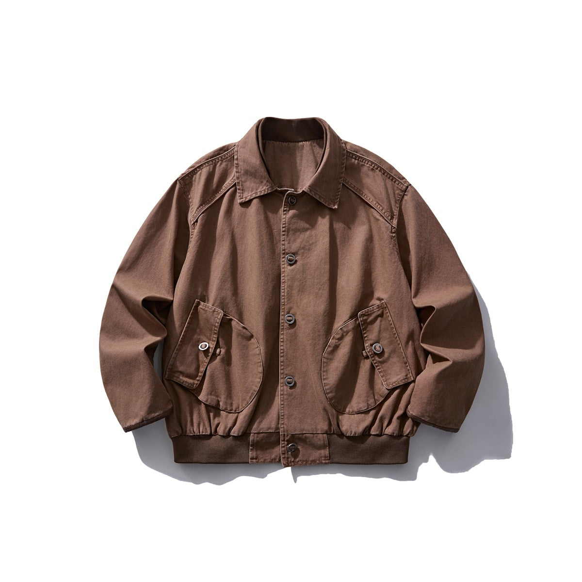 Brown collared button-front jacket flat lay with two large flap pockets and ribbed hem