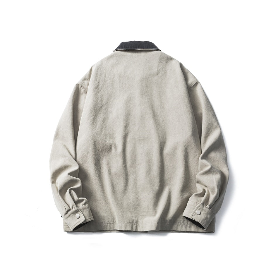 Back view of a pale gray-green jacket with a dark collar and buttoned cuffs, shown flat on white.