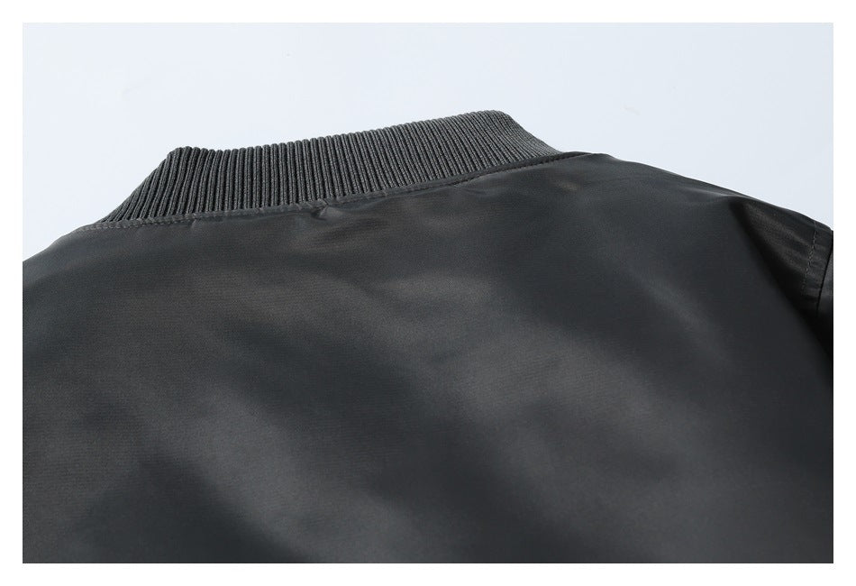 Close-up of the dark jacket back and its ribbed collar.