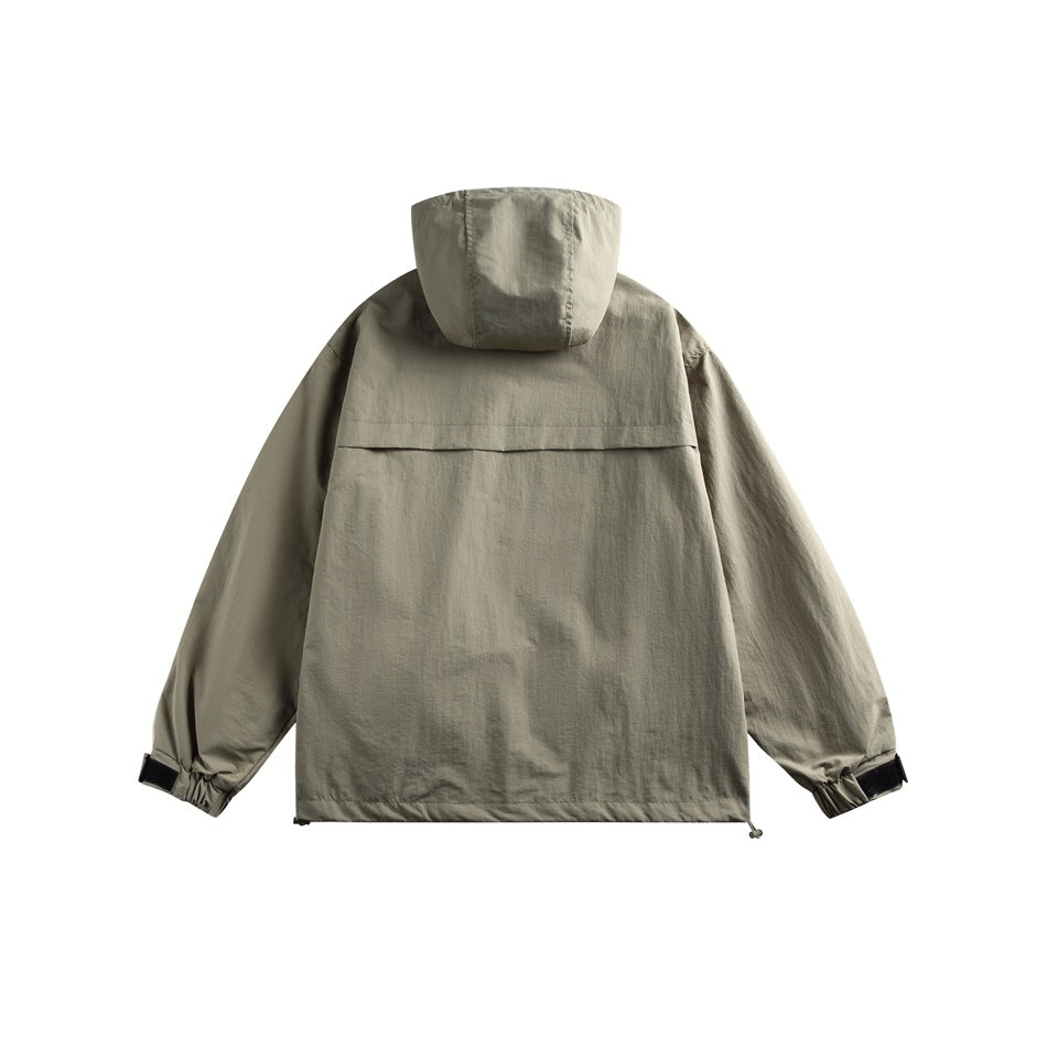 Back view of a gray-green hooded jacket with a wide back yoke and adjustable cuffs.