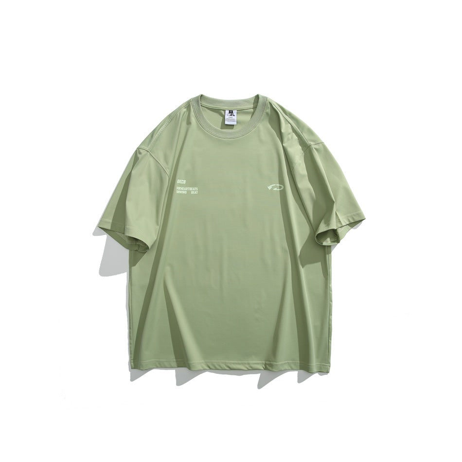 Front view of a pale sage oversized crew-neck T-shirt with small light chest text and an emblem.