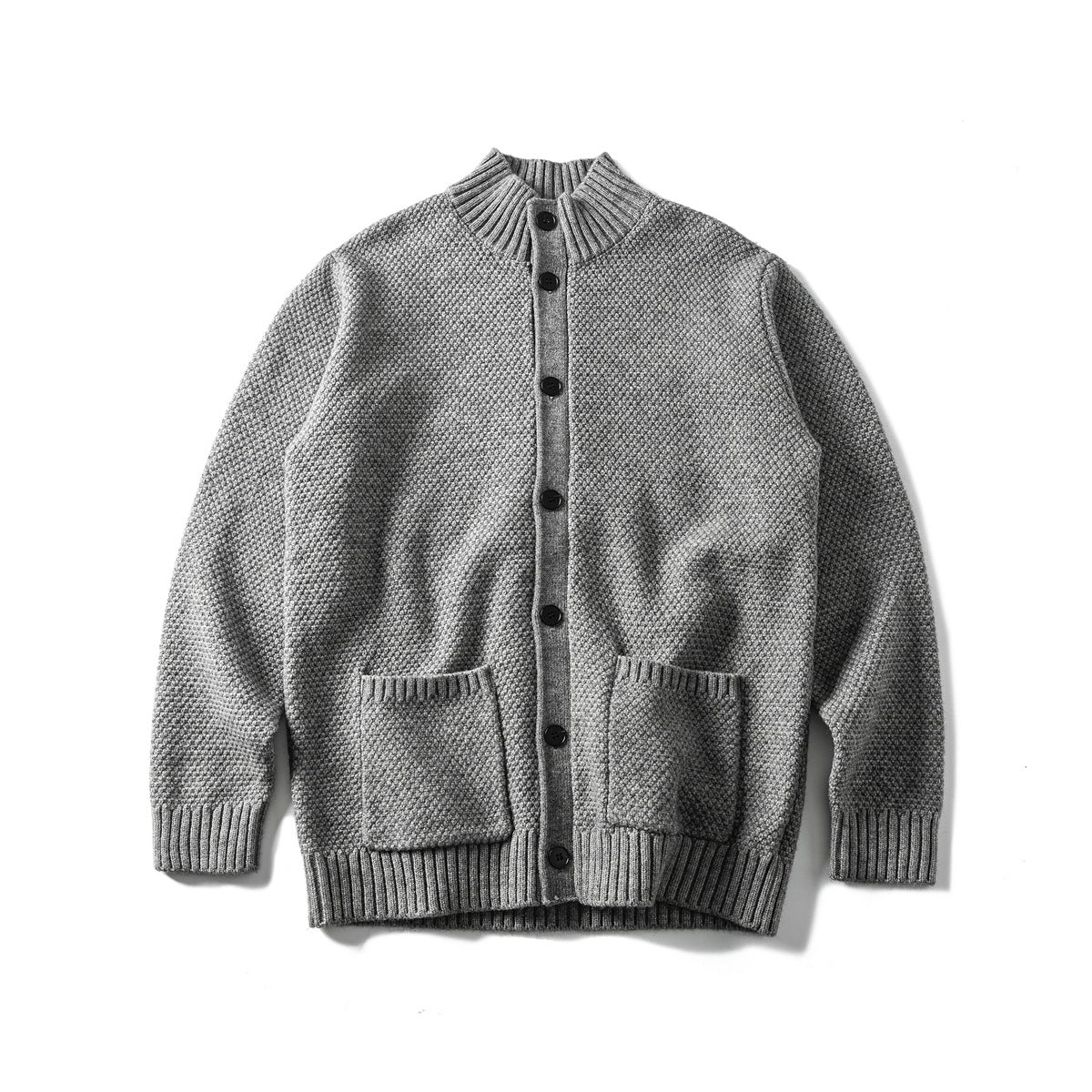 Gray textured knit button-front cardigan with ribbed stand collar and two patch pockets, flat lay