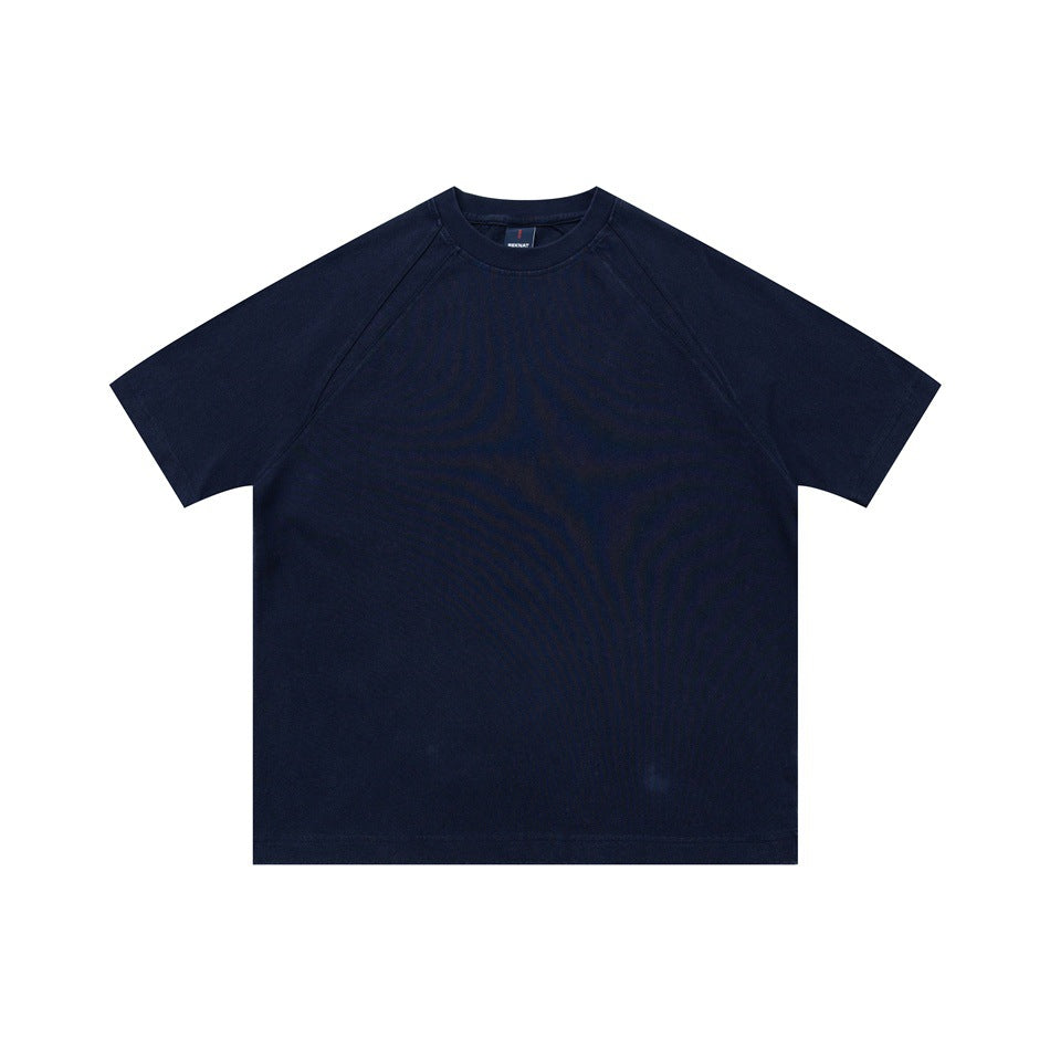 Navy blue short-sleeve raglan crew neck T-shirt, flat front view on white background