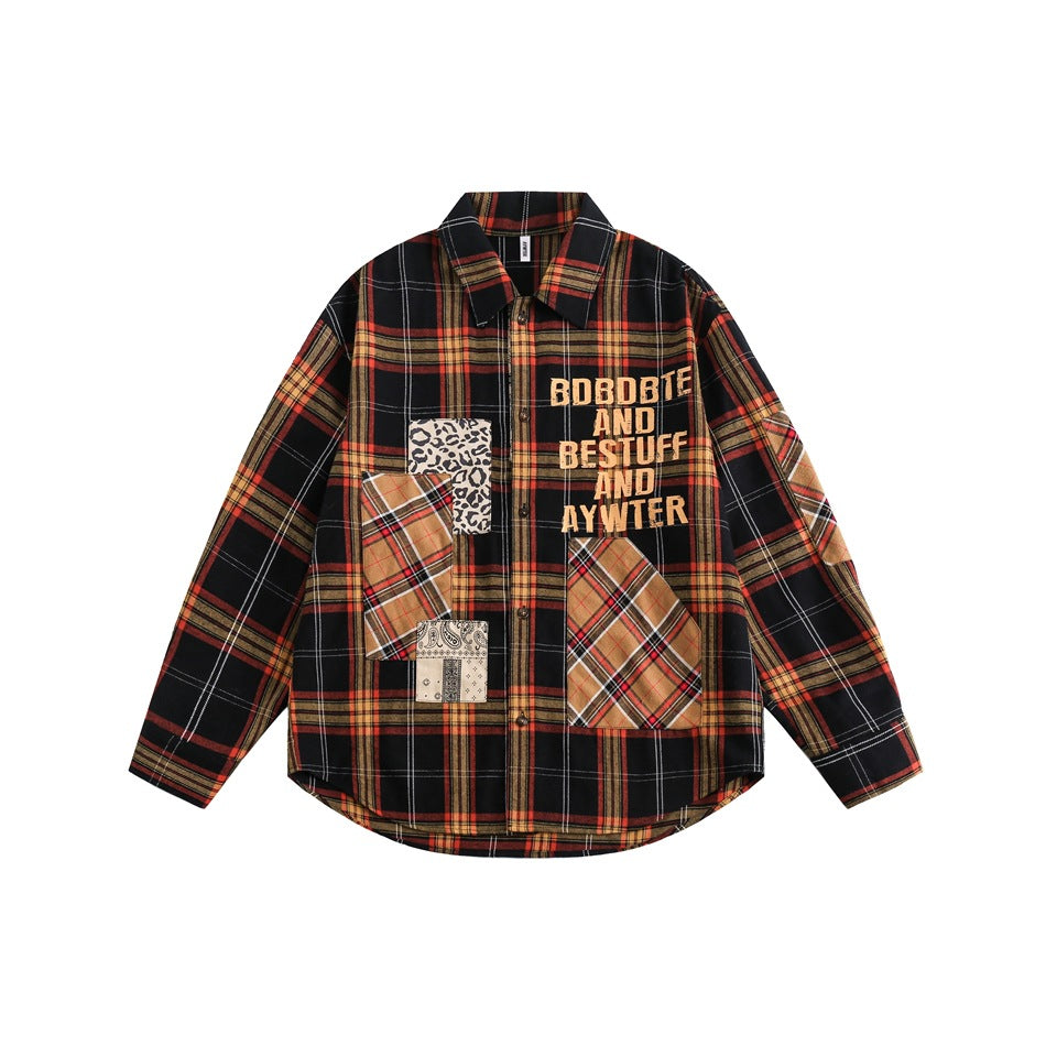 Black, red and orange plaid long-sleeve shirt with leopard, plaid and paisley patches and orange lettering on the chest