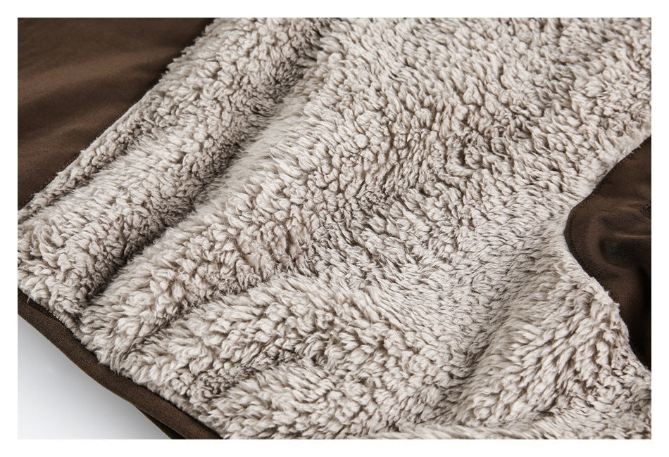 Close-up of plush light gray lining bordered by dark brown outer fabric.