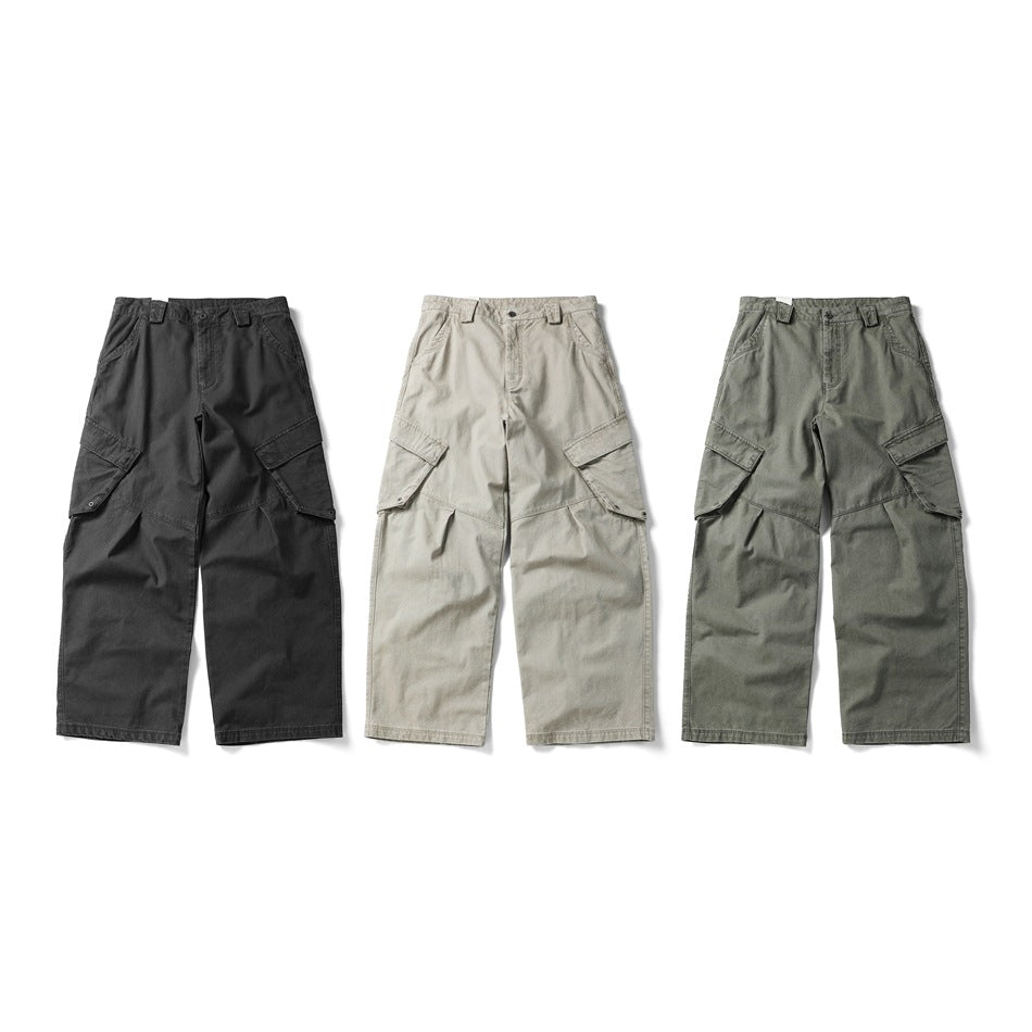 Three pairs of wide-leg cargo pants shown from the front in charcoal, light beige and olive gray.