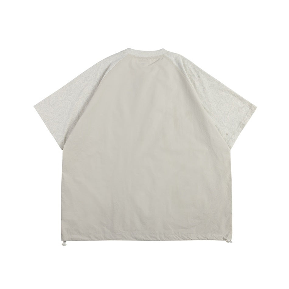 Back view of a light beige raglan T-shirt with heathered short sleeves and a plain body.